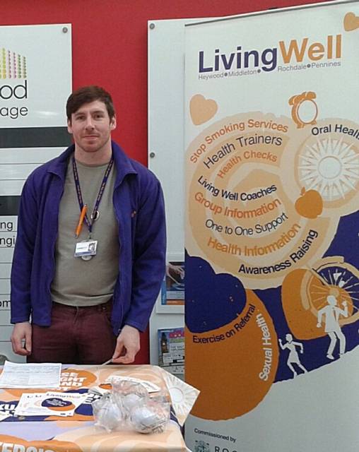 Adam McCarthy manning the Living Well stand at a wellbeing event