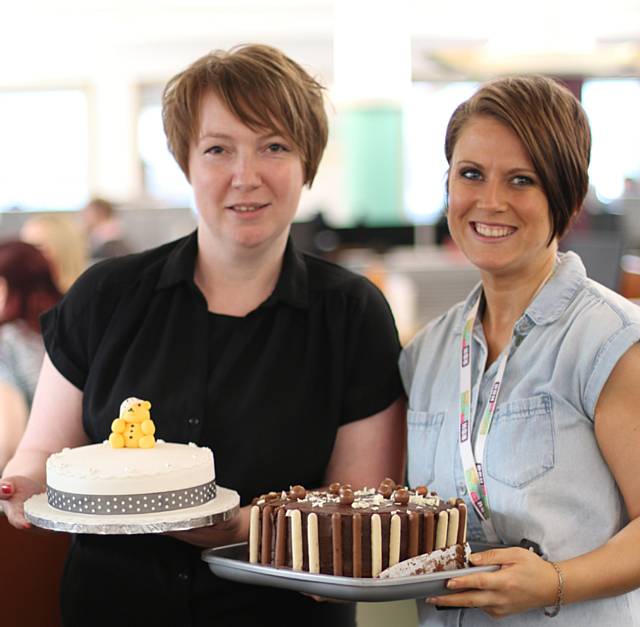 RBH Environmental Surveyor Katie Fletcher and Mechanical Surveyor Ella Cooper with two of the charity cakes