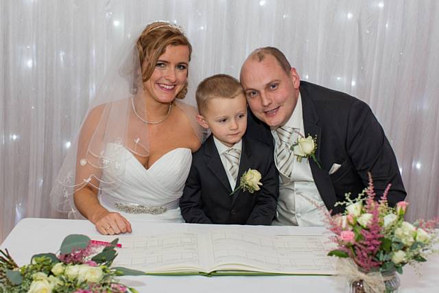 Katy Harris and David Smith with their son Danny on their wedding day