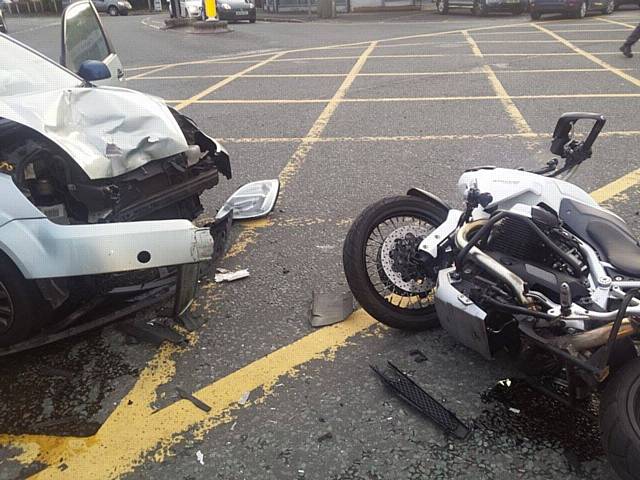 Aftermath of a collision between car and motorbike