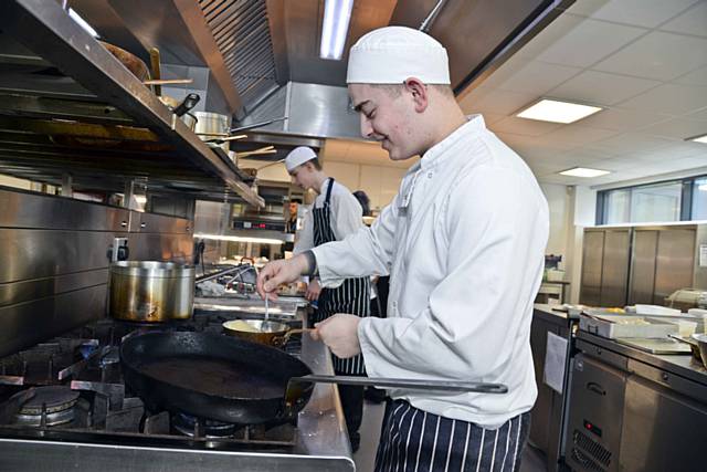 Students cooking in the Riverside Restaurant