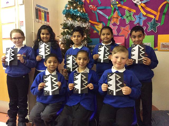 Year Three and Four at Belfield Community School send Christmas cards to members of the community of Cumbria 