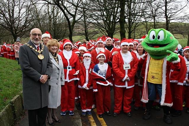 Mayor Surinder Biant and Mayoress Cecile Biant with Springy the Frog at the Springhill Hospice Santa Dash or Dawdle