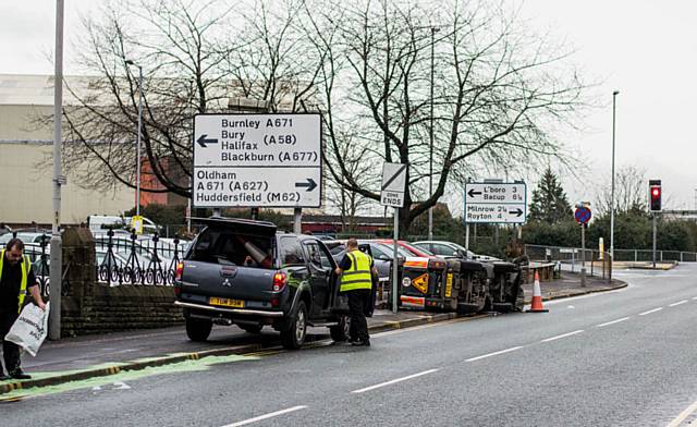 Overturned road sweeper on Smith Street