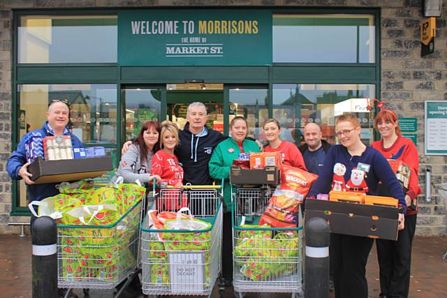 Andy O’Sullivan (Centre) with Morrisons staff and Martin Topham, Petrus Community (L)