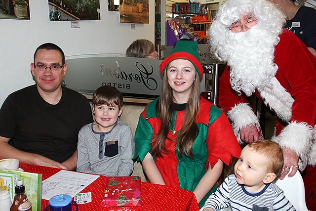 William and Harry Smith with Santa and his Elf