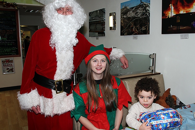 Rio Reilly with Santa and his Elf