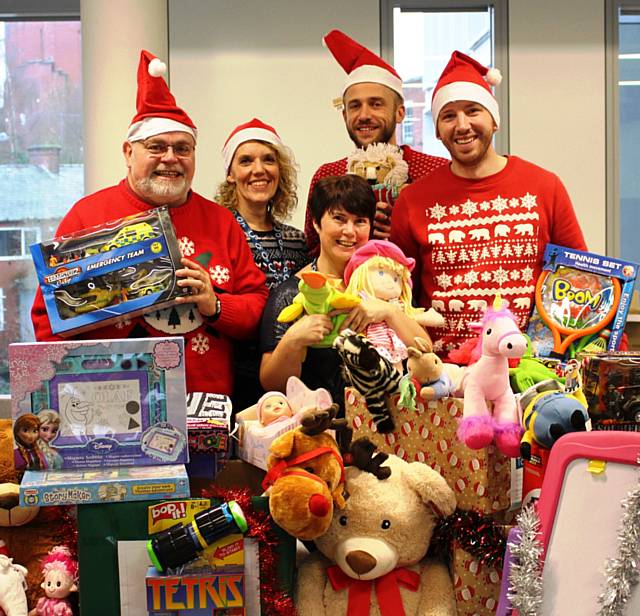 Giving Back Charity Members Michael McCann, Helen Leach, Sue Milne, Dan Swann and Mark Jones prepare to sort some of the 1,300 gifts ready for delivery