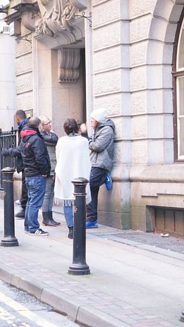 Rebecca Hughes, Joanne Lord and John North talking to the homeless at the former Manchester Stock Exchange