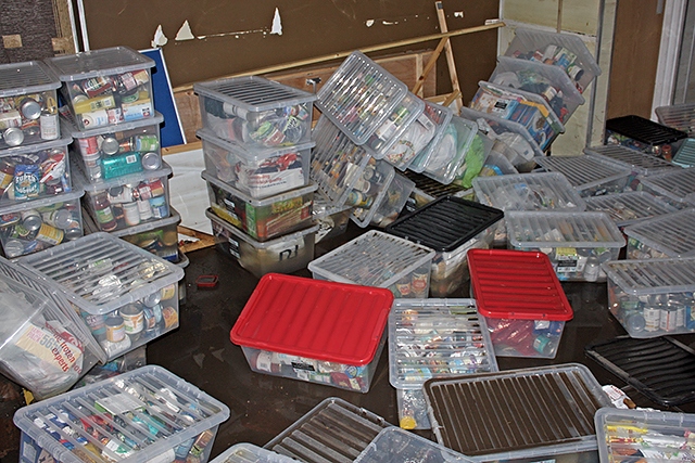 Food containers floating in flood water at Rochdale Foodbank