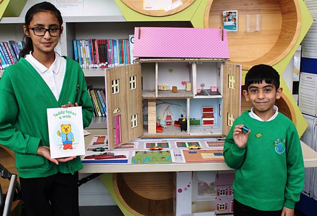 Pupils from Deeplish Primary Academy – Marium Yousaf (Year 6) and Hasan Ahmed (Year 2) with the road safety dolls house.