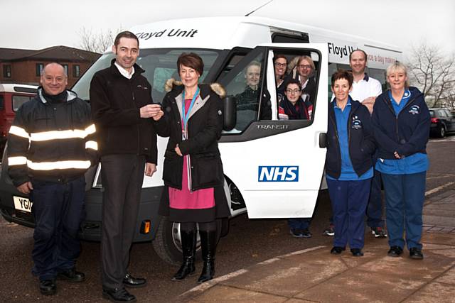 Andy Pass, transport supervisor at The Pennine Acute Hospitals NHS Trust, Tony Dawson, Arrow Self Drive Workshop Manager, and Karen Gaunt, Floyd unit manager, with members of staff from the unit