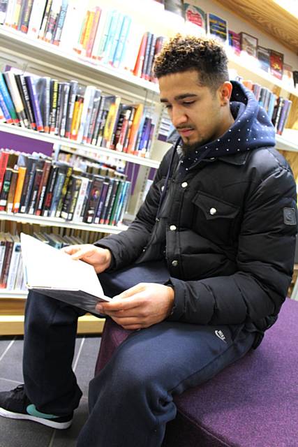 Bastien Hery paused to have a look at some of the books on offer in Rochdale Central Library
