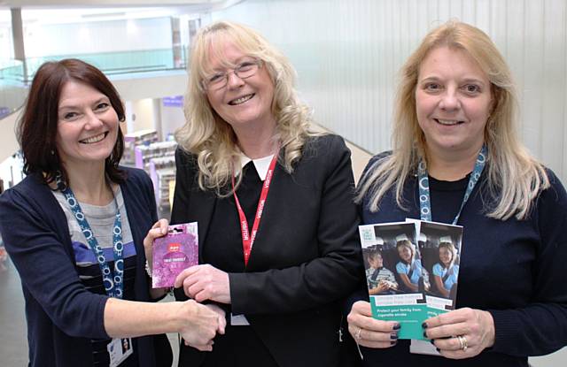 Pauline Beasley is presented with her voucher by Lisa Barker (left) and Jacqui Evans (right) from the council's Public Protection Team