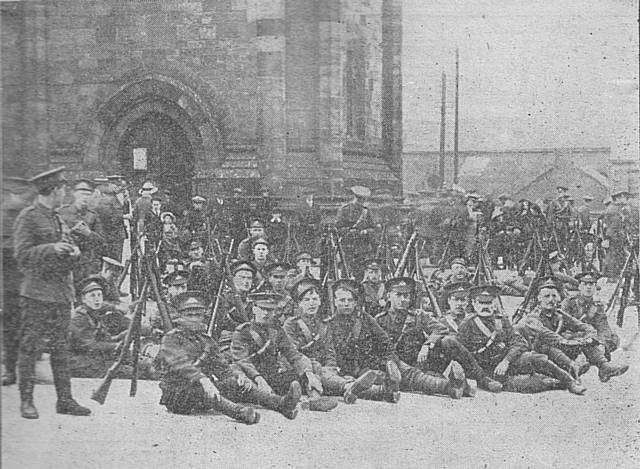 Members of the 1/6th Lancashire Fusiliers, the Rochdale/Todmorden/Middleton Territorials in front of the town hall and practising