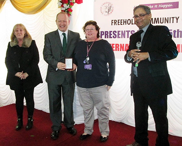 Pat Long with Simon Danczuk presenting Christine Henderson with her award and Mohammed Azhar