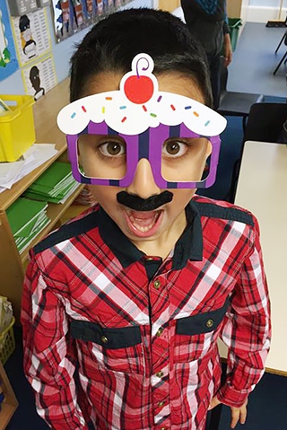 Broadfield Community Primary School pupil making his face funny for moeny for Red Nose Day