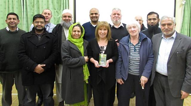 Cllr Mohammed Zaman, Linden and Samina Zaheer together with local community leaders present a Plaque to Val White, Chair of Forum Sohail Ahmad, and Vice Chair Ahmed Nawaz with Vera Lomax