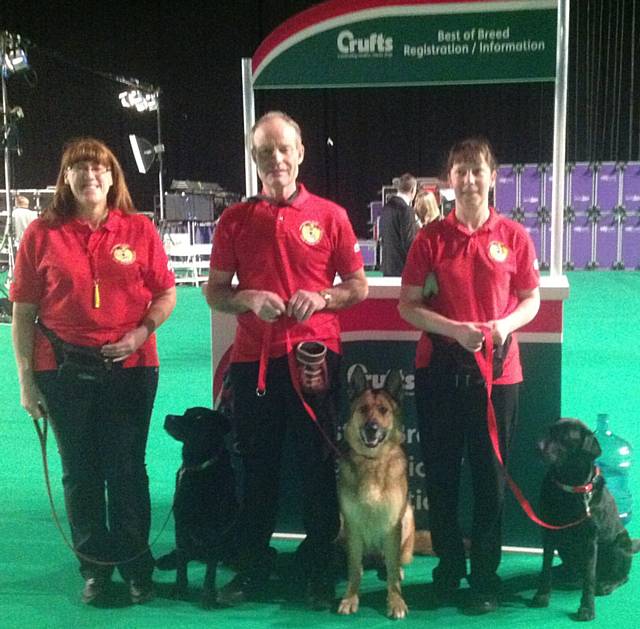 Gold display team member from On Track Dog Training Peter Yates with Pepper a German Shepherd, Joanne Borg and Shelley Sandiford with labrador litter sisters Abbie and Flo .