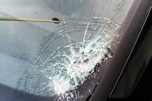 Father and son have lucky escape after stones thrown from motorway bridge smash car windscreen