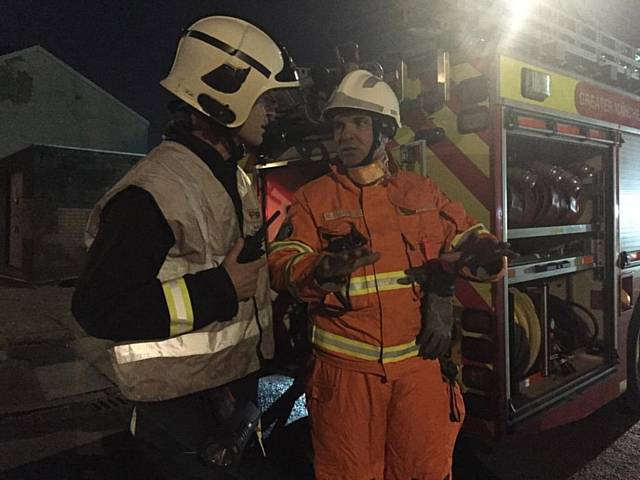 Officer in charge Angus Robinson and WM Mick Bloomfield planning the next searches of the building
