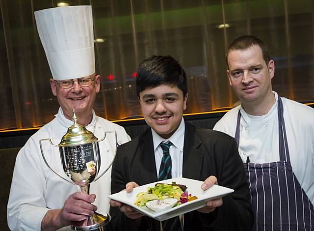 Judges Hopwood Hall College lecturer Brian Yates (left) and Sam Everett from Harvey Nichols (right) with  junior master chef winner Zayn Janghir (centre)