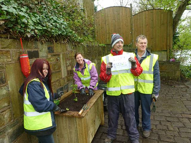 The Littleborough Adopt a Canal Group plant containers to brighten up the Durn Wharf 