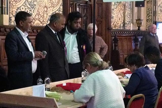 UKIP candidate Mohammed Masud (second left) and colleagues at Rochdale Town Hall for the General Election count