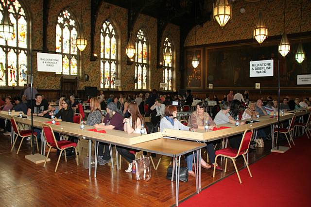 Counters waiting to start in the Great Hall at Rochdale Town Hall.