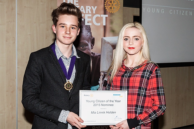 Ethan Marriott, Member of Youth Parliament for Rochdale presents a certificate to  Mia Linnik Holden 