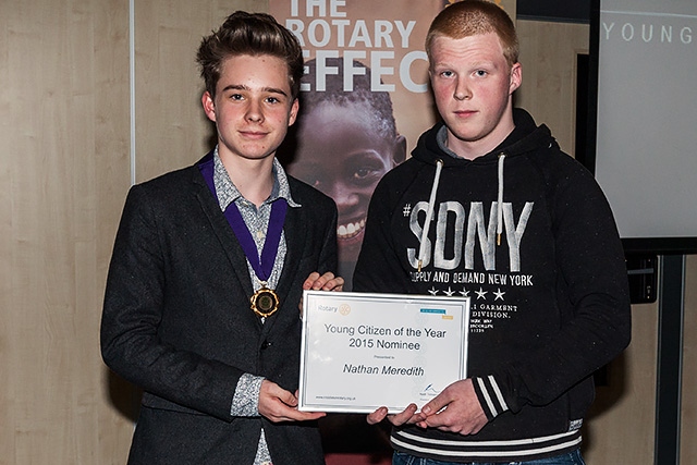 Ethan Marriott, Member of Youth Parliament for Rochdale presents a certificate to Nathan Meredith