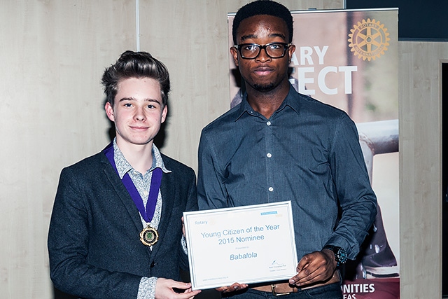 Ethan Marriott, Member of Youth Parliament for Rochdale presents a certificate to Nathan Meredith