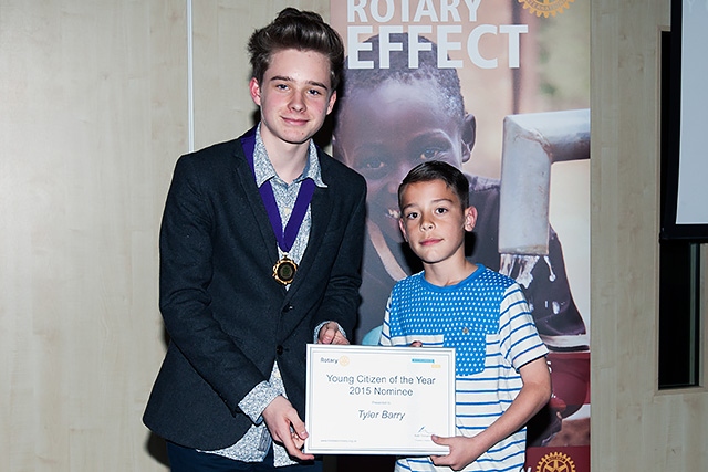 Ethan Marriott, Member of Youth Parliament for Rochdale presents a certificate to Tyler Barry