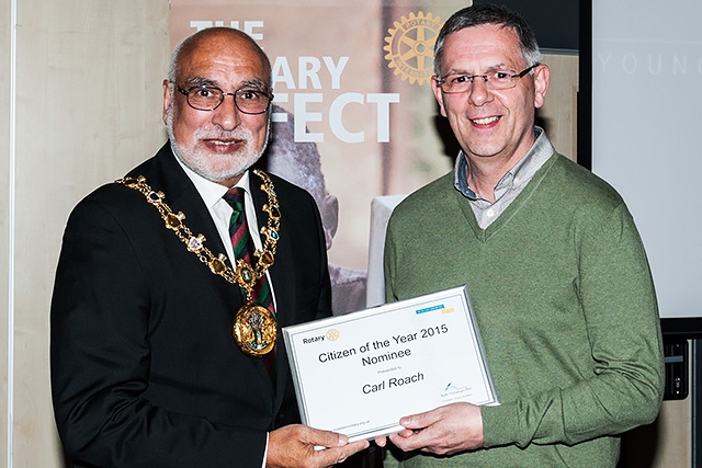 Mayor of Rochdale Surinder Biant presents a certificate to Carl Roach