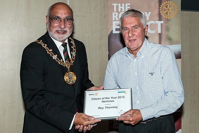 Mayor of Rochdale Surinder Biant presents a certificate to Roy Thorniley