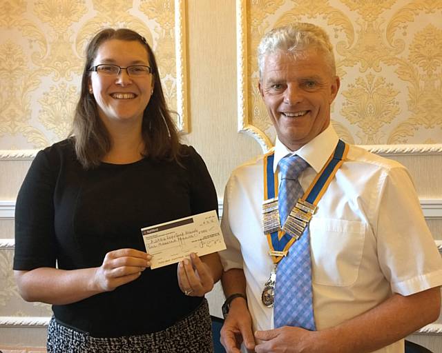 Deborah Sefton NSPCC Community Fund-Raising Manager for Greater Manchester with President Bob Chadwick of Rochdale Rotary Club 