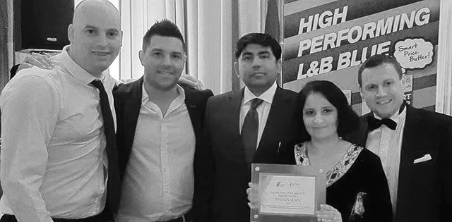 Councillor Rashid (centre) with staff with his award and a representative of Ignite Imperial Tobacco