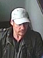 CCTV image of a man police want to trace in connection with a report of indecent exposure.