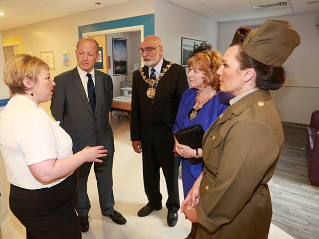 Dr Shona McCallum and Sr Lou Harkness-Hudson, clinical matron at Rochdale Infirmary (dressed in 1940s army costume) both showing local MP Simon Danczuk and the Mayor and Mayoress of Rochdale inside the Oasis unit for medical patients with dementia 