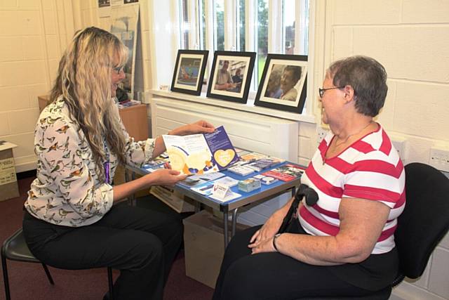 Information and advice worker Kim Chadwick helps signpost Joyce Gordon to services which might help her