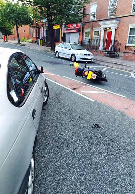 A collision between a taxi and a bike on Long Street in Middleton