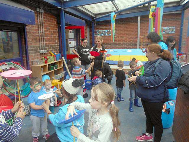 Children and parents try their hand at plate spinning during Newbold’s teddy bear’s picnic