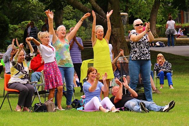 Families enjoy an afternoon’s entertainment in Queens Park