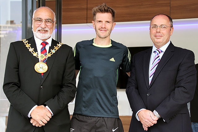 Fourth place in the Rochdale Half Marathon Andrew Challenger collects his prize