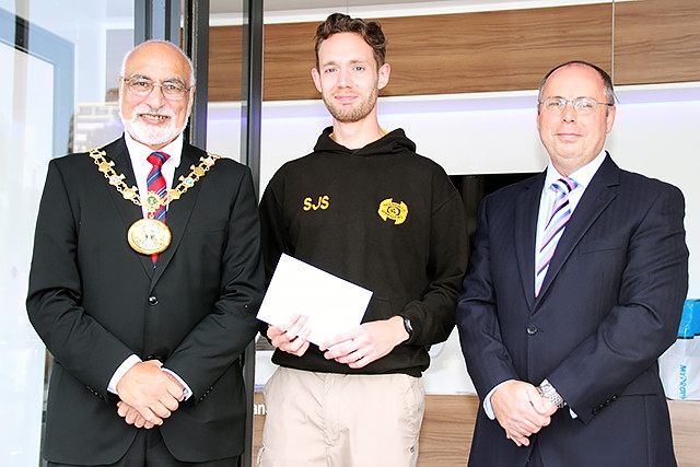 Fifth place in the Rochdale Half Marathon Stuart Sharp collects his prize