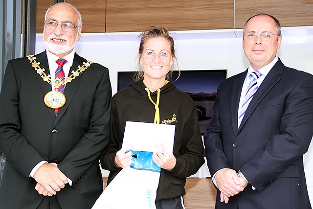 Rochdale Half Marathon fifth place female runner Jennifer Bloor collects her prize