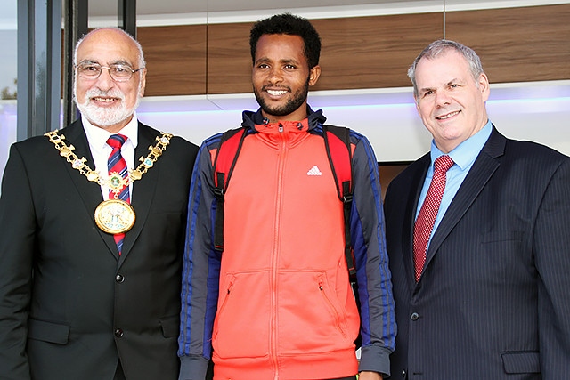 Rochdale 10k run second place runner Tesfaye Debeie collects his prize