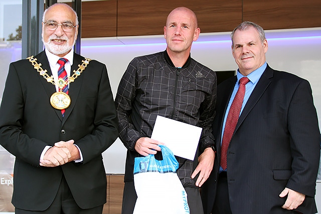 Rochdale 10k run fourth place runner Billy McCartney collects his prize