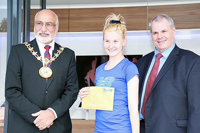 Rochdale 10k run third place female runner Annabel Ralph collects her prize