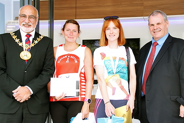 Rochdale 10k run female team runners winners Oldham and Royton collect their prize